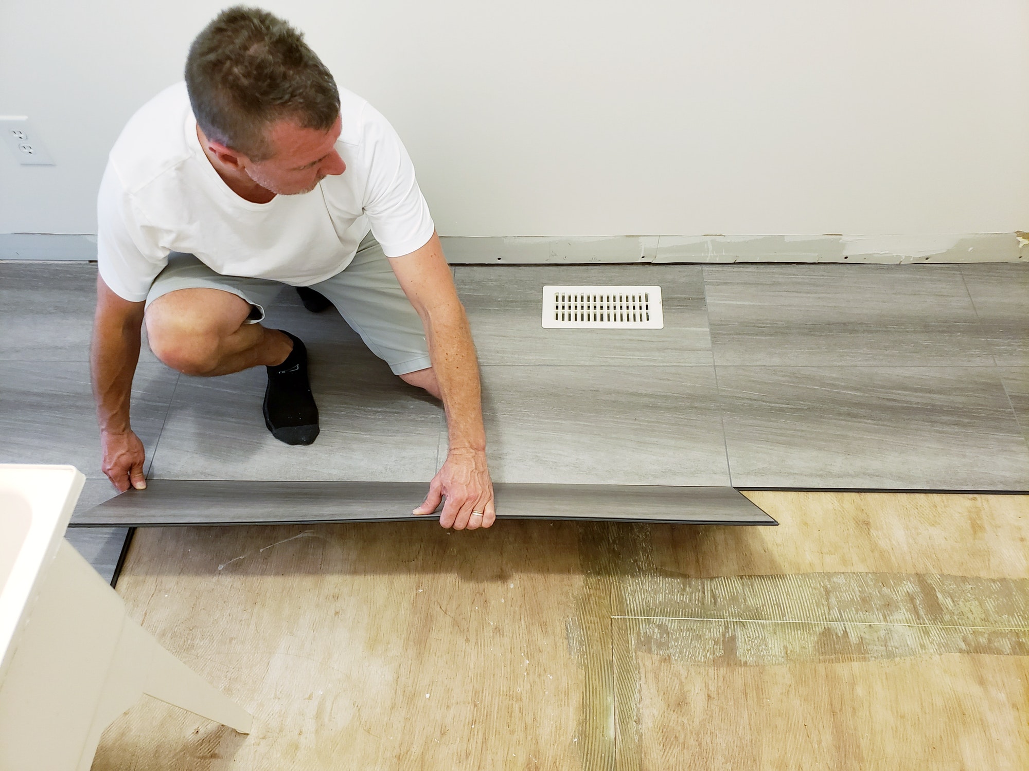 flooring installation updating floor to new laminate clipboard that looks like ceramic tiles